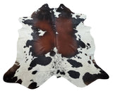 A dark brown cowhide rug is the perfect way to add a touch of luxury to your home. This natural pattern is exotic and unique, making it a valuable addition to any room.