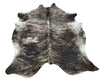 A beautiful genuine brindle cowhide rug in a vibrant shade brings the taste of the country to your interior. 