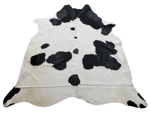 This cowhide rug features an exotic Holstein pattern with salt pepper in the back, inspired by nature, cowhide will make a bold anchor in modern space