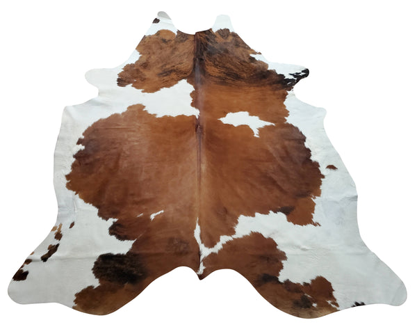 A perfect size cow skin rug for your kitchen space, beautiful tricolor that compliments the floor and our cowhides are free shipping USA.