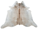 This beige grey cowhide rug is absolutely beautiful in person, it will stunning in any room, it is soft and velvety.