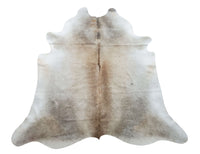 This cowhide rug is stunning mix of grey and tan, it will be a great addition to any room, the texture is very soft, inviting and feels great under foot. 
