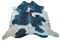 Blue turquoise cowhide rugs are the talk of the town and metallic looks terrific used as a rug or hung on the wall.