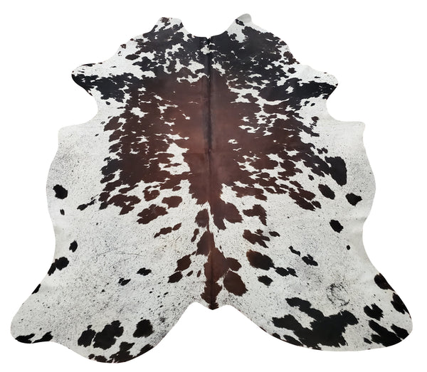 A tricolor cowhide will go with any modern look, with beautiful wallpaper wall, fire place and cottage touch, all cowhides are custom and free shipping