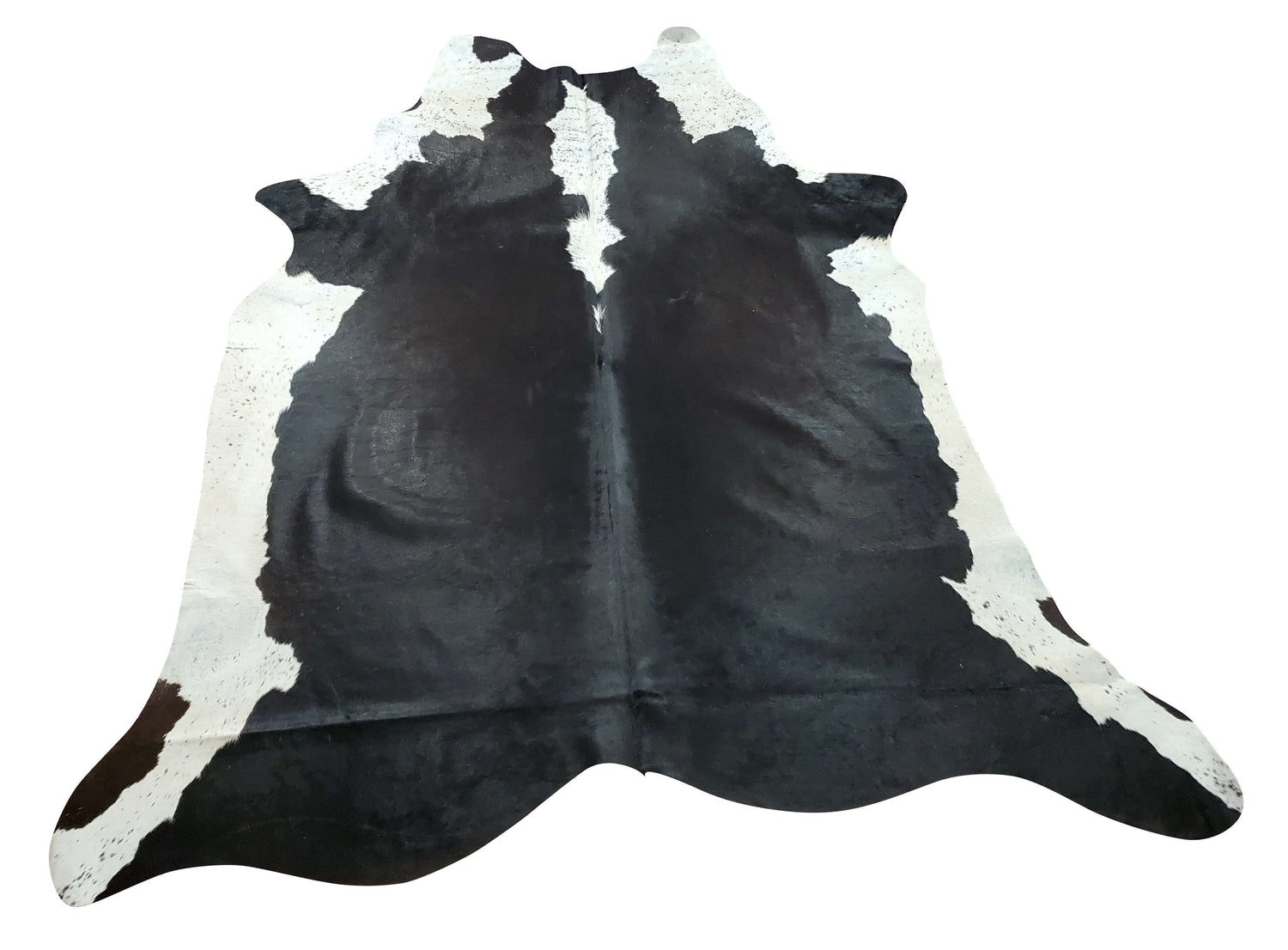 Probably the best cow rug you will own to date, great flexibility, very soft, and well treated black and white makes great accent piece for any room