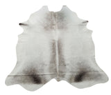 This grey cowhide rug with some ivory is beautiful, the natural shade is impeccable. It is so plushy and soft, perfect for any space of your house. 