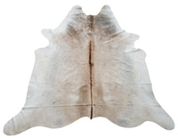 This cowhide rug in exotic beige grey is absolutely stunning and very high quality. 