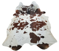 A tricolor cowhide rug will add a western element to your living room, it will be the focal point of the space, compliments any western or modern living room wall.