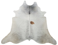This is absolutely beautiful grey cowhide rug with some tan, the colors are superb and transform the space. 
