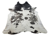If you are wondering what to put under the cowhide rug the back is finished to suede and no need to put anything.