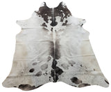 This grey and white cowhide rug will look perfect in any room. It is hand-made and has a soft feel.