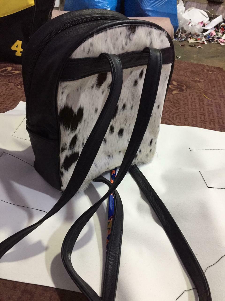 A black white customized cowhide baby bag with lots of characters and options, lets us if you need cowhide bag for a present before a certain date