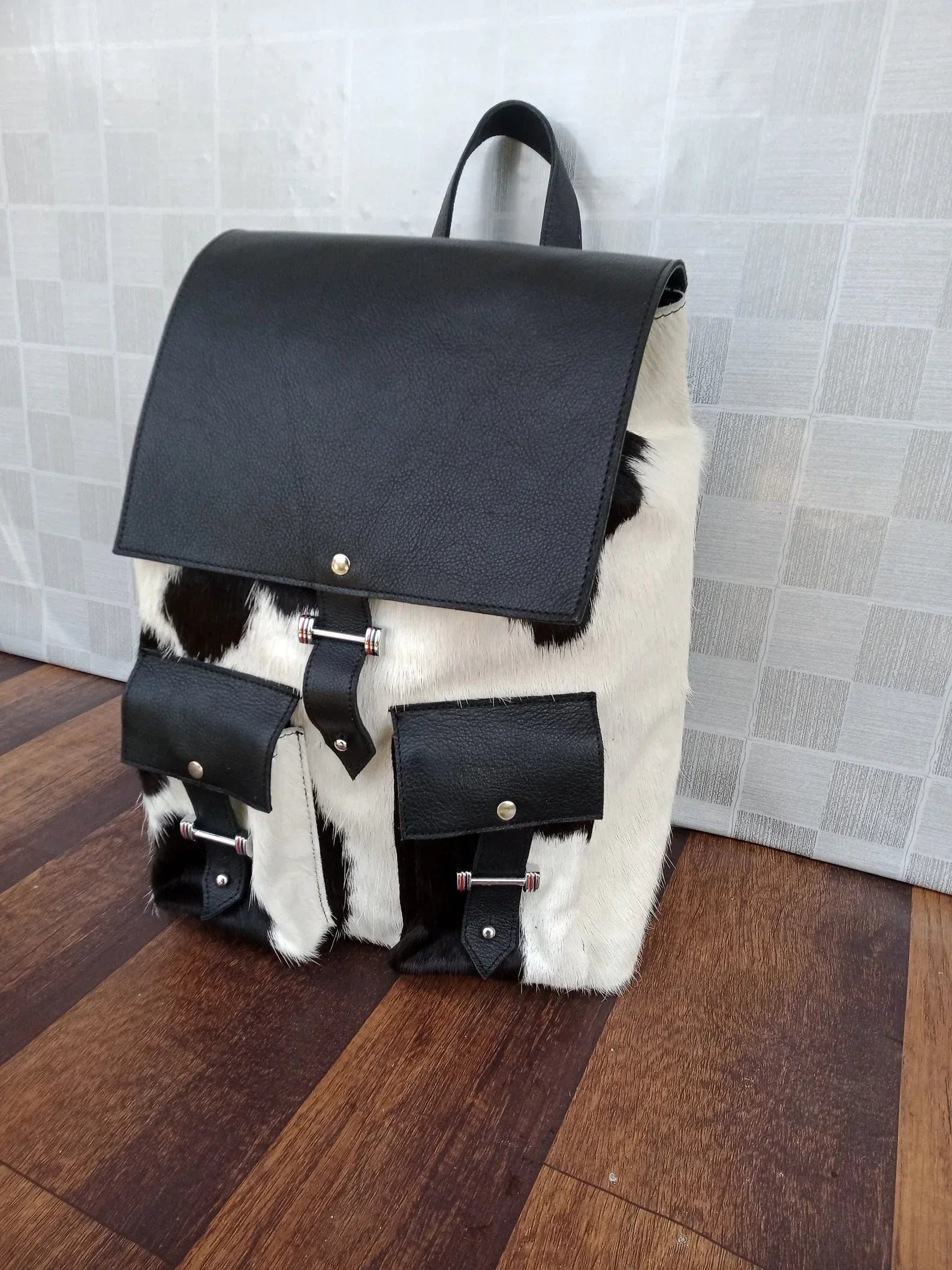 Black leather cowhide backpack with hair on hide