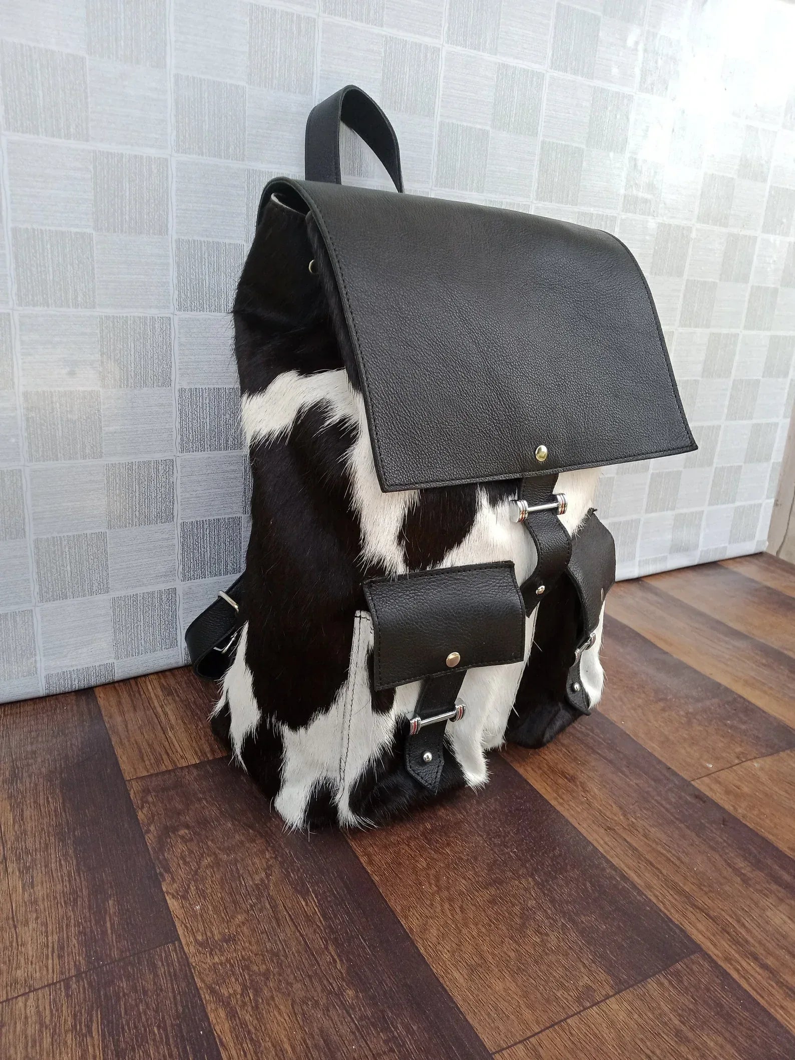 Black leather cowhide backpack with hair on hide