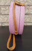 Assortment of handcrafted rattan purses with intricate patterns.
