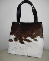 A night out with friends is the perfect opportunity to show off your style. And what better way to do that than with a stylish cowhide tote bag