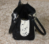 You will recieve a cowhide shoulder bag similar to the one shown, we will send you the pattern to choose from and will be custom made to your needs.
