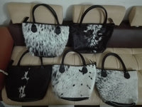 black and white cowhide bucket bag