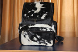 Absolutely gorgeous hair on cowhide purse made from real fur, the bag looks even better in person! So soft yet sturdy  with a shoulder strap.