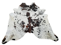 A large and beautiful salt and pepper cowhide rug with lots of dark brown, black and white, with free shipping all over USA. 