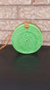 Stylish rattan crossbody bag with a leather strap and woven texture.